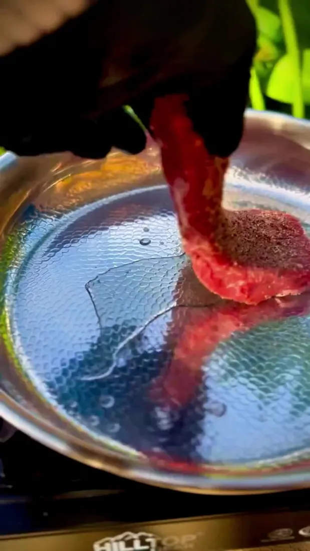 Steak placed on the hammered titanium surface