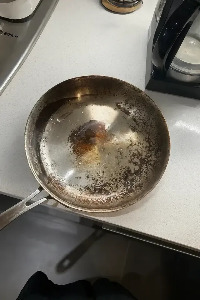 Old pan with a worn cooking surface